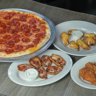 Lg 1 topping pizza, 6 wings, skins, & tenders ($43.99)